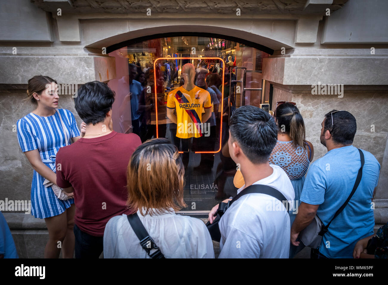 Barcelona, Spain. 04th Sep, 2019. Several people observe the new showcase at the club store.The FC Barcelona football club opens a new store in the heart of the Ramblas of Barcelona. Located at number 124, it has 1,900m2 and is the fifth store managed 100% by the FC Barcelona. Interior design has been done by designer and design theorist Juli Capella. Credit: SOPA Images Limited/Alamy Live News Stock Photo