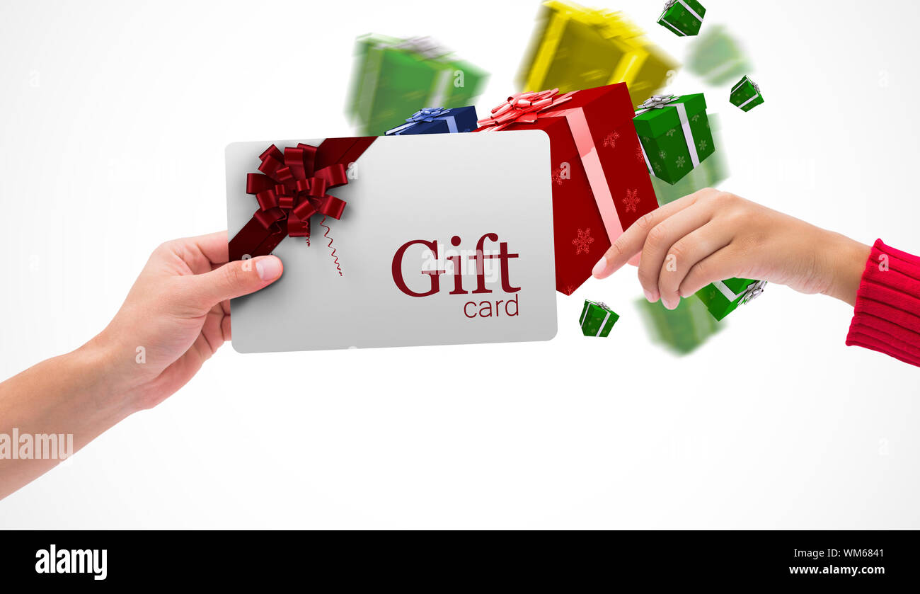 Hands holding card against gift card with festive bow Stock Photo - Alamy