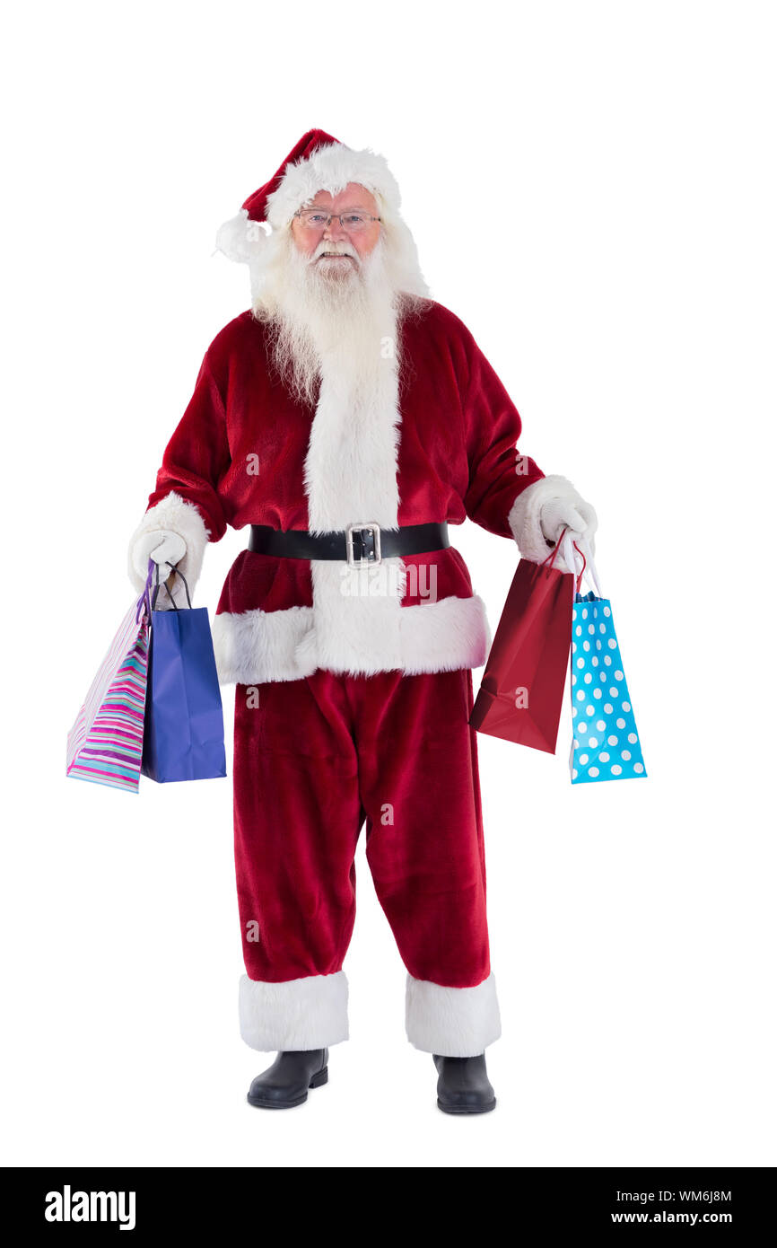Santa carries some Christmas bags on white background Stock Photo - Alamy
