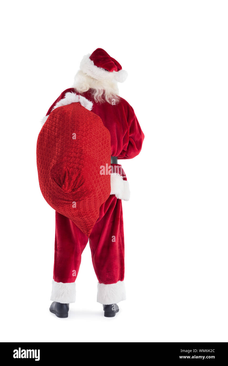 Santa carries his bag away on white background Stock Photo - Alamy