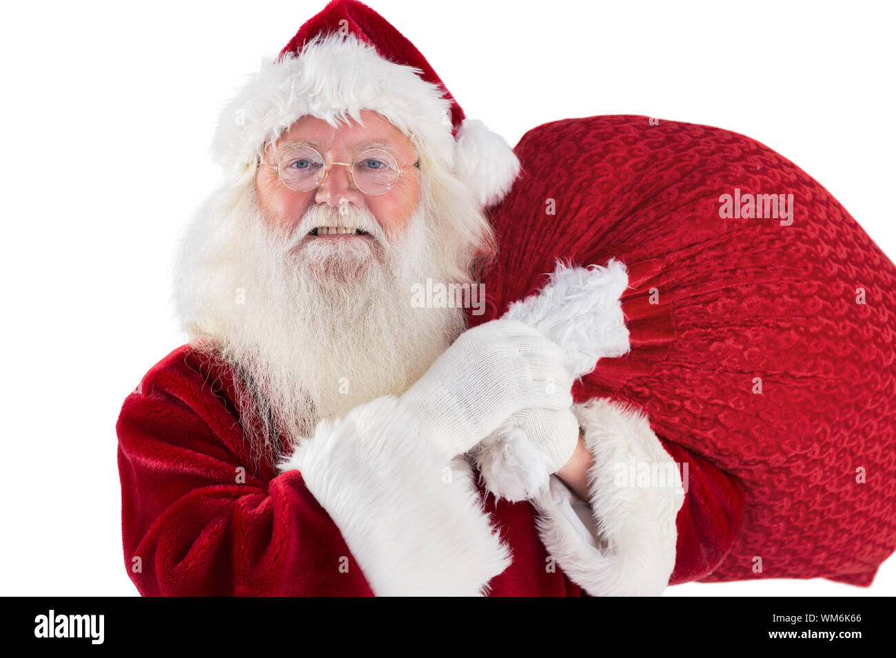 Jolly Santa carries his sack on white background Stock Photo - Alamy