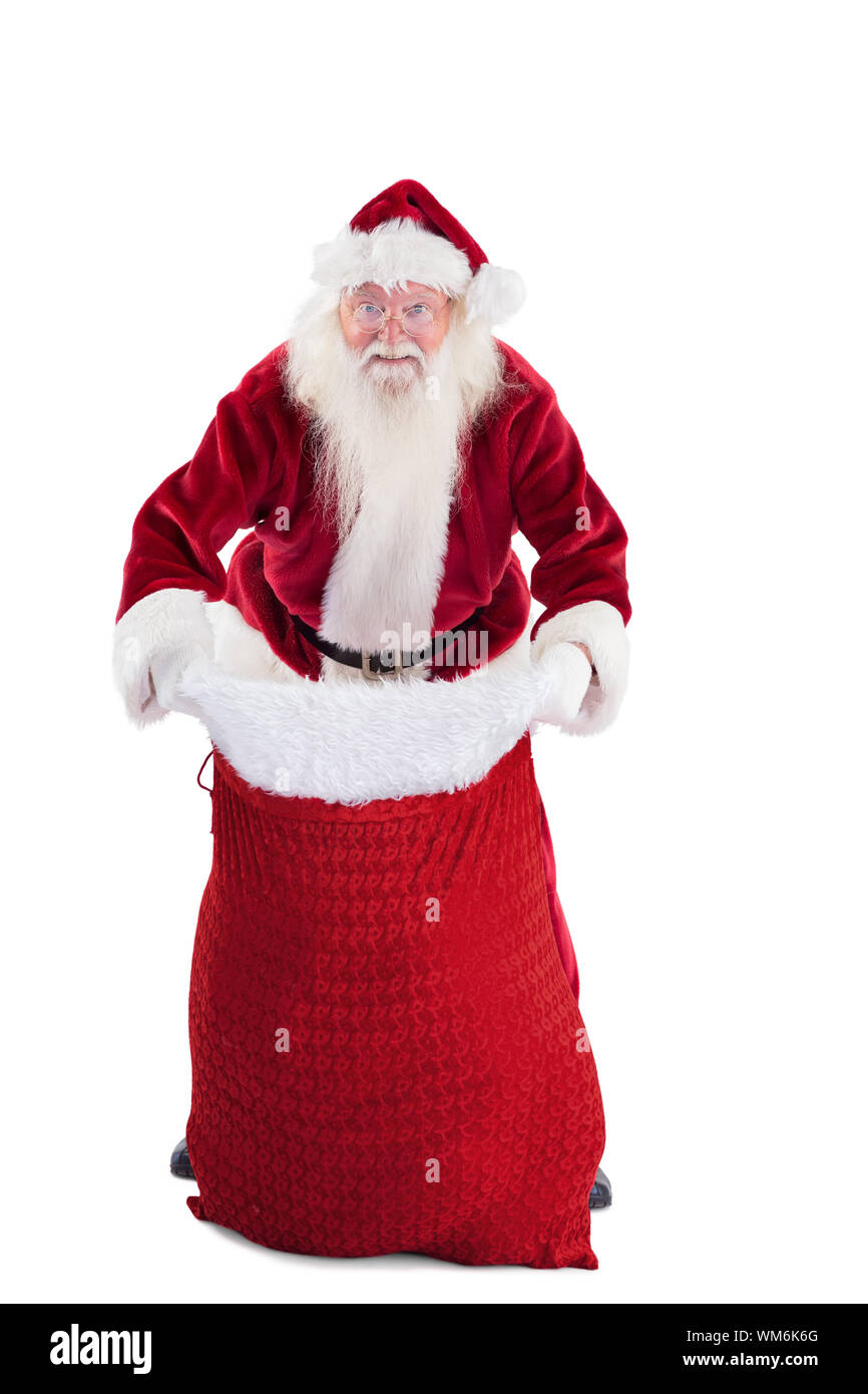 Santa open his red bag on white background Stock Photo - Alamy