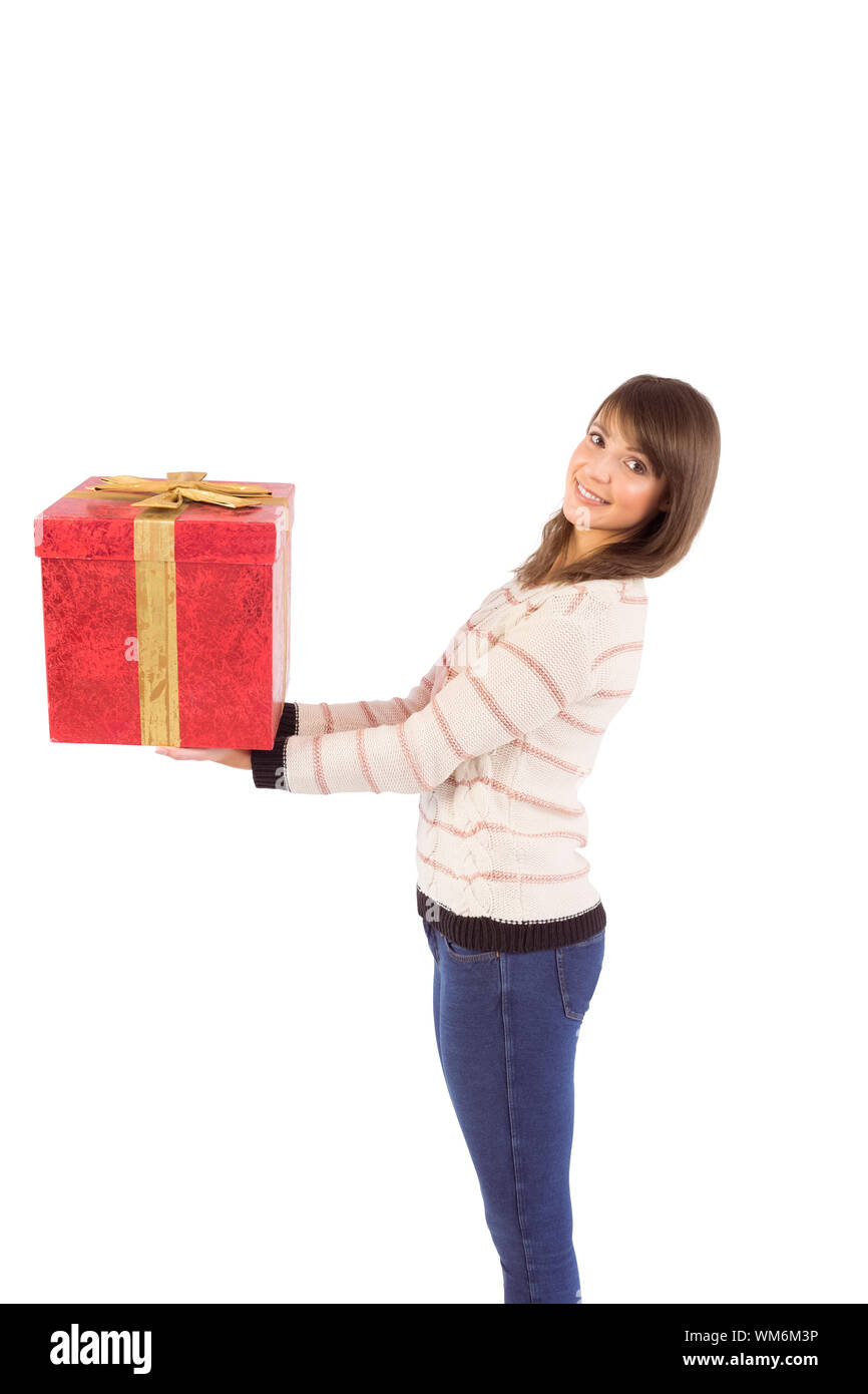Young woman holding a gift on white background Stock Photo - Alamy