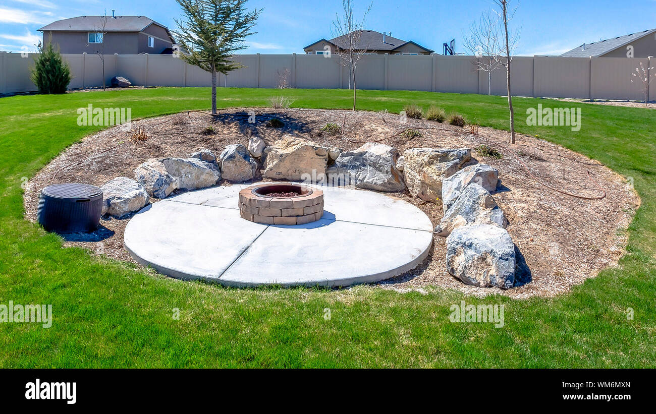 Panorama Frame Circular Fire Pit Surrounded By Rocks In The Middle