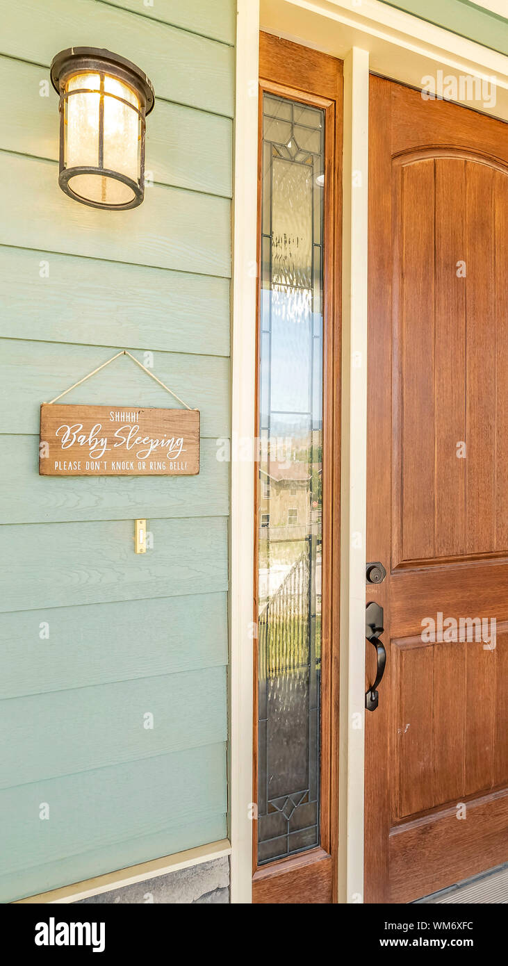Vertical Frame A Home With Brown Front Door Sidelight Green Wood