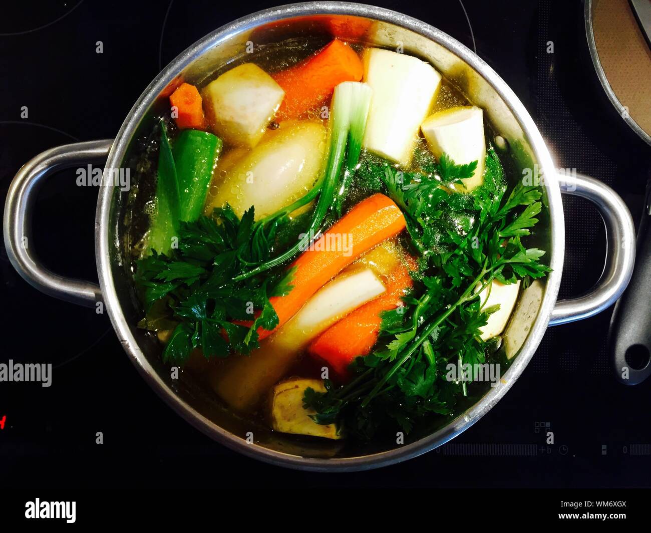 Download High Angle View Of Vegetables Boiling In Container Stock Photo Alamy PSD Mockup Templates