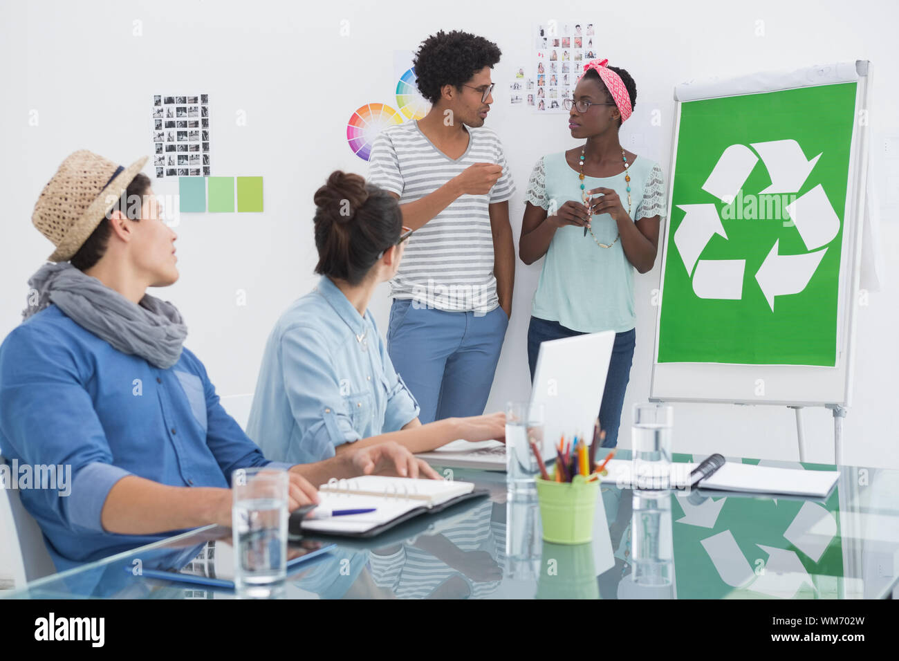 Young creative team having a meeting about recycling in creative office Stock Photo