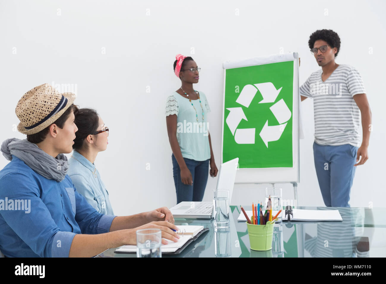 Young creative team having a meeting about recycling in creative office Stock Photo