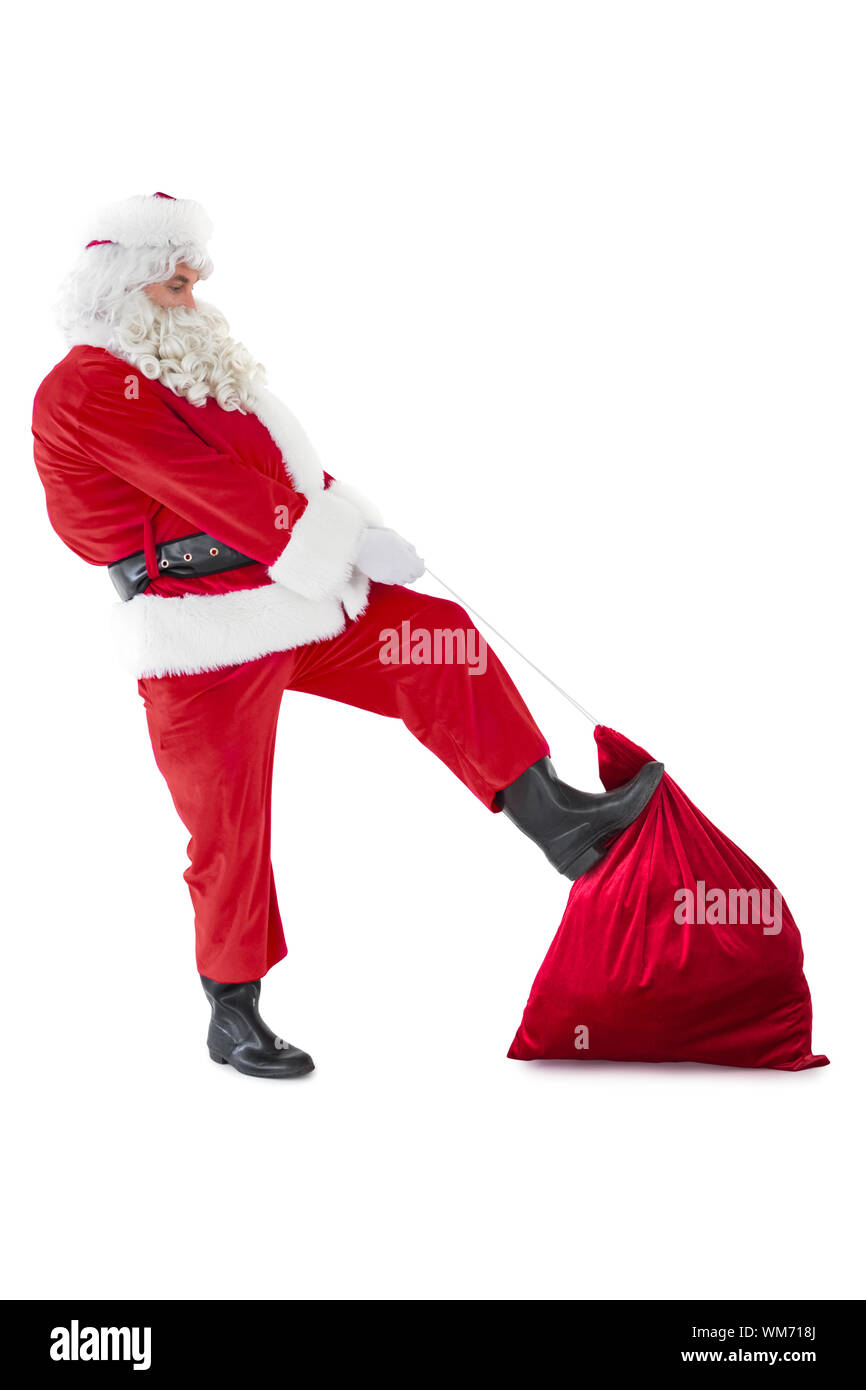 Santa claus clothing his sack on white background Stock Photo - Alamy