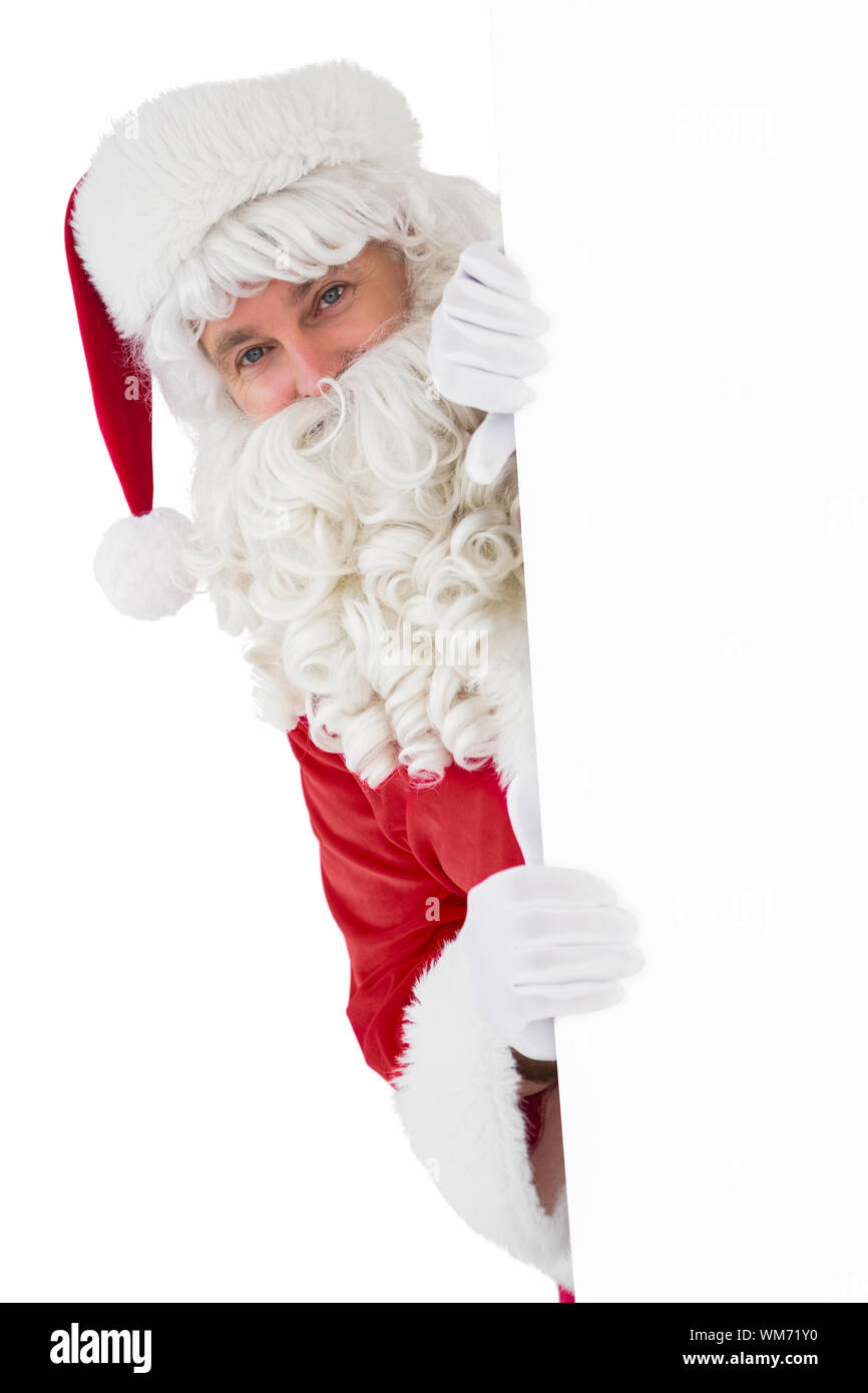 Happy santa claus holding poster on white background Stock Photo - Alamy