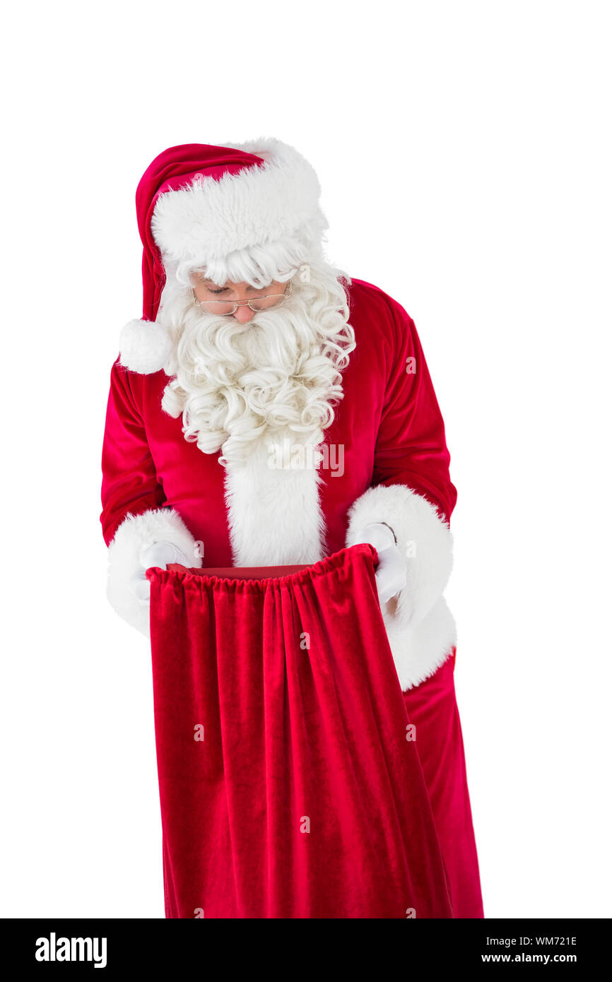 Santa claus looking in sack on white background Stock Photo - Alamy