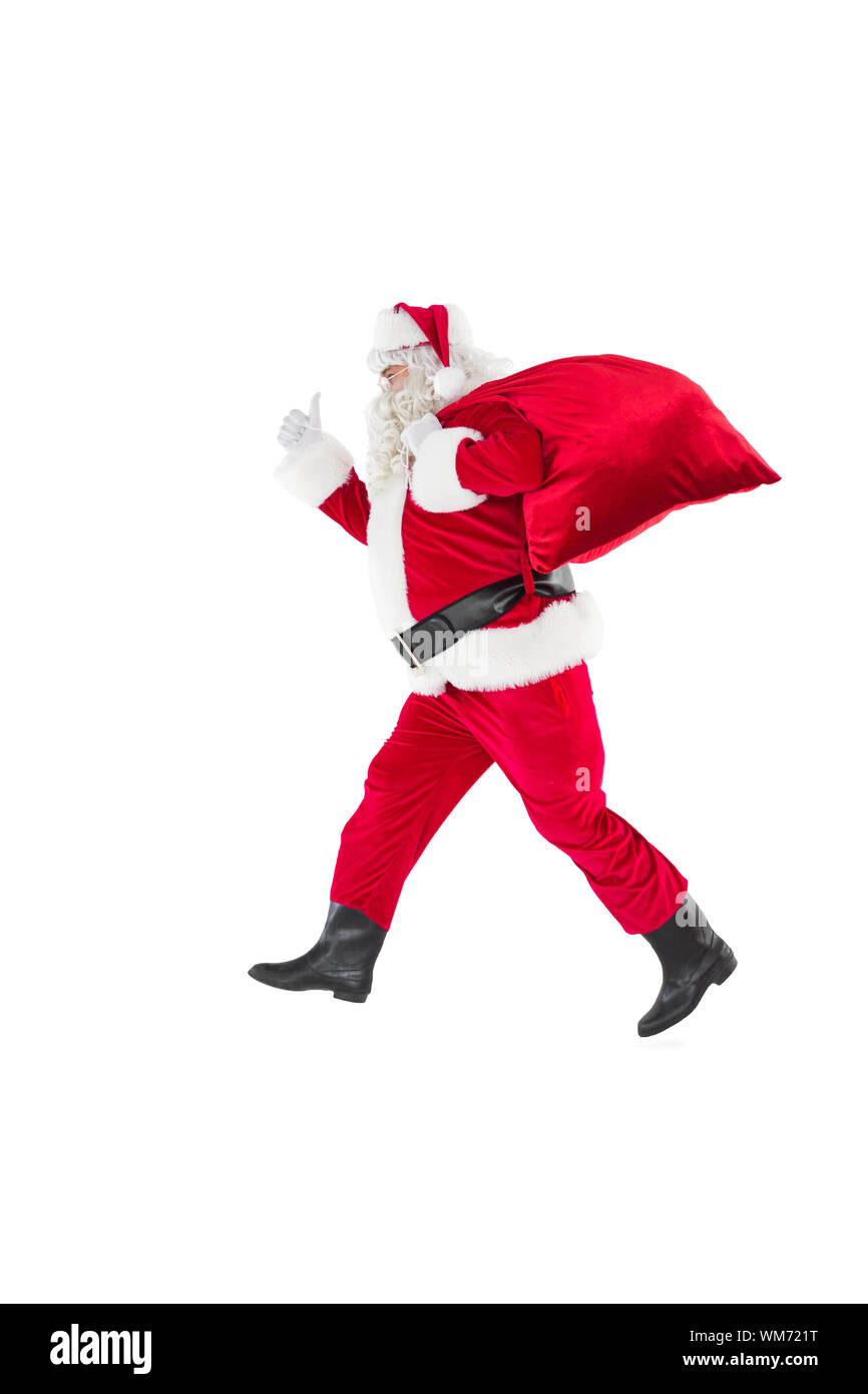 Positive santa with a sack and thumbs up on white background Stock ...
