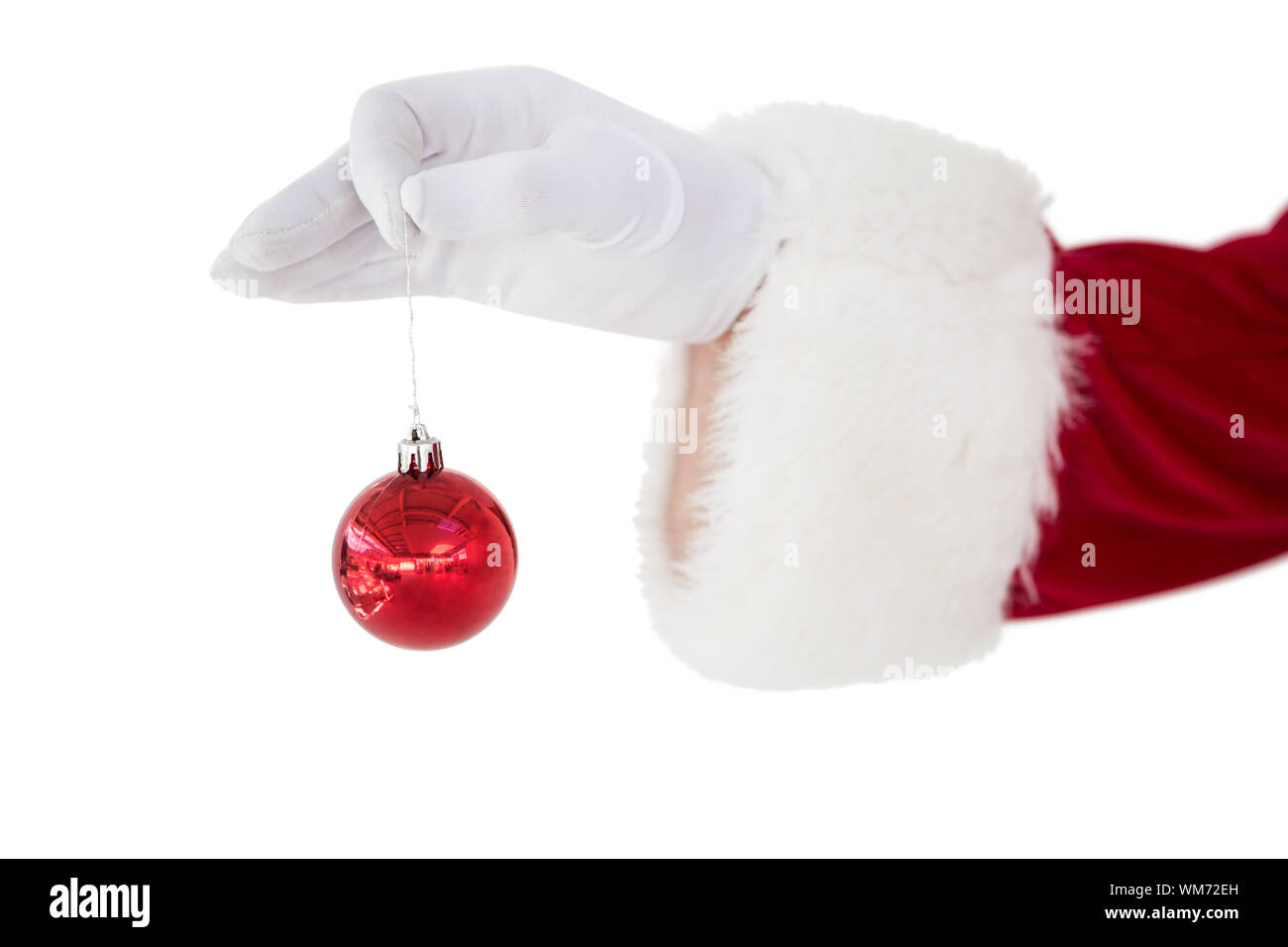 Santa claus holding red bauble on white background Stock Photo
