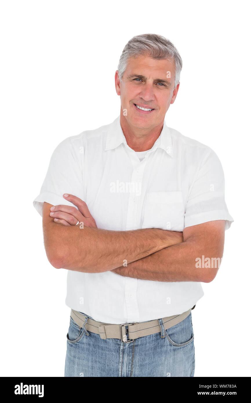 Casual man smiling at camera on white background Stock Photo - Alamy