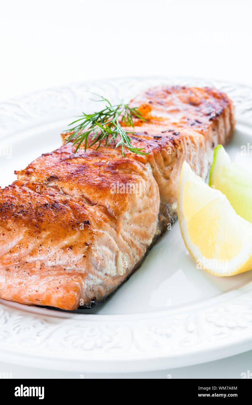 Grilled salmon fillet with lemon, lime and dill Stock Photo - Alamy