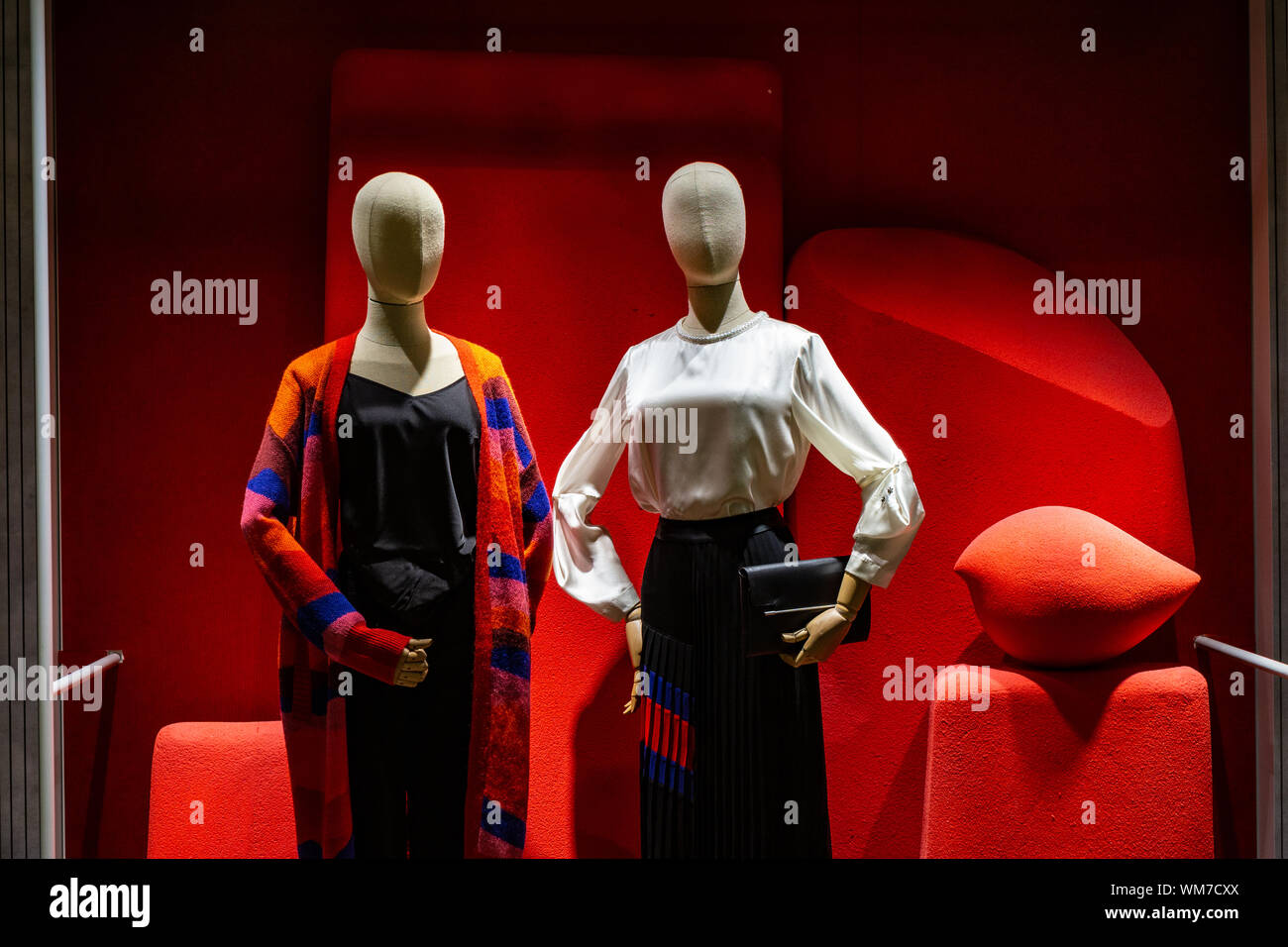 Beautiful mannequins in soft light and red background Stock Photo - Alamy