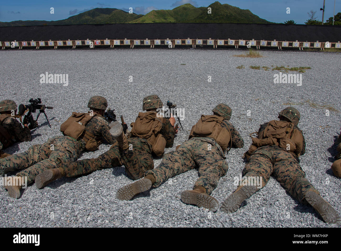 Marines with Weapons Company, Battalion Landing Team, 2nd Battalion, 1st Marines, 31st Marine Expeditionary Unit, battlesight zero their weapons at Camp Hansen, Okinawa, Japan, Aug. 29, 2019. The 31st MEU, the Marine Corps' only continuously forward-deployed MEU, provides a flexible and lethal force ready to perform a wide range of military operations as the premier crisis response force in the Indo-Pacific region. (Official U.S. Marine Corps photo by Cpl. Cameron E. Parks) Stock Photo