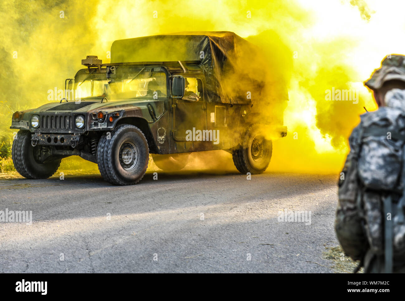 Vehicles drive to extraction point during a joint excercise on Fort