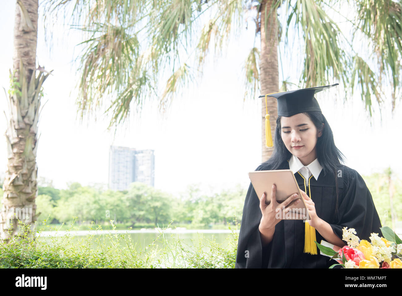 Beautiful Woman Graduating Using Tablet Pc Graduate Asian Woman