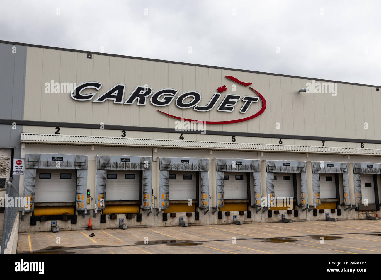 Empty loading docks at CargoJet's main base at John C. Munro Hamilton International Airport. Stock Photo