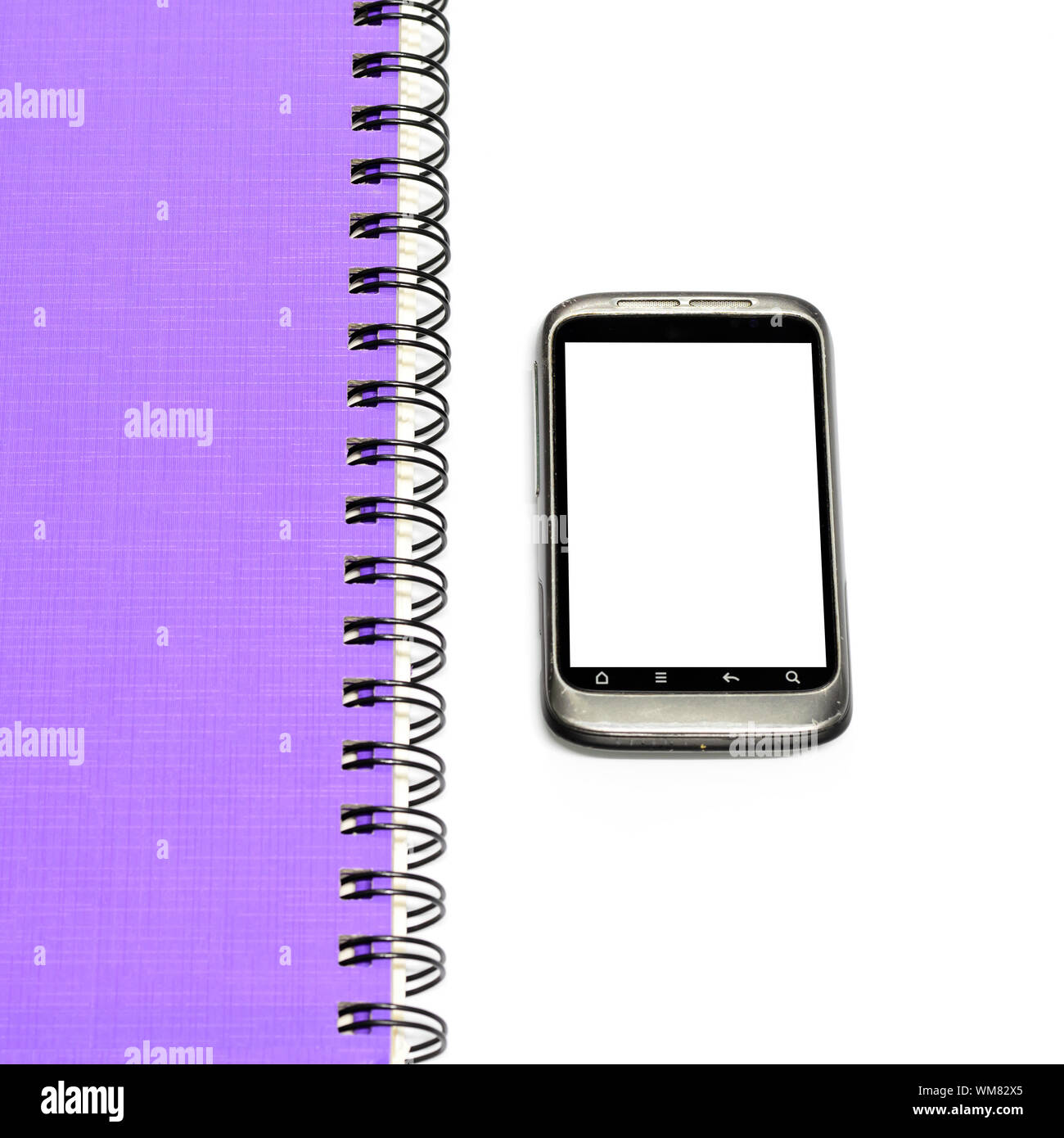 used smartphone with grey note book Stock Photo