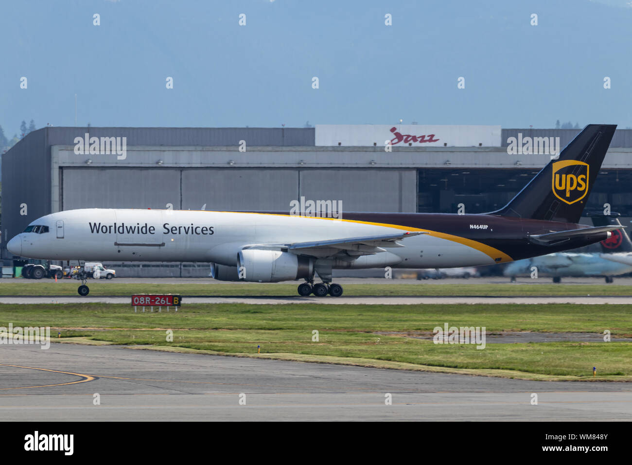 UPS Airlines Boeing 757F taking off from Vancouver Intl. Airport on a sunny day. Stock Photo