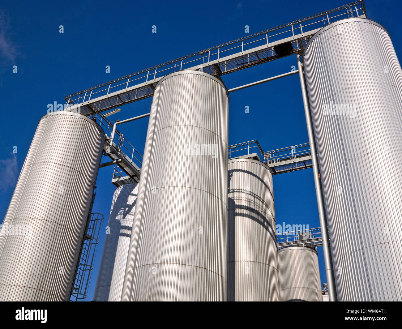 Silos towards blue sky Stock Photo - Alamy