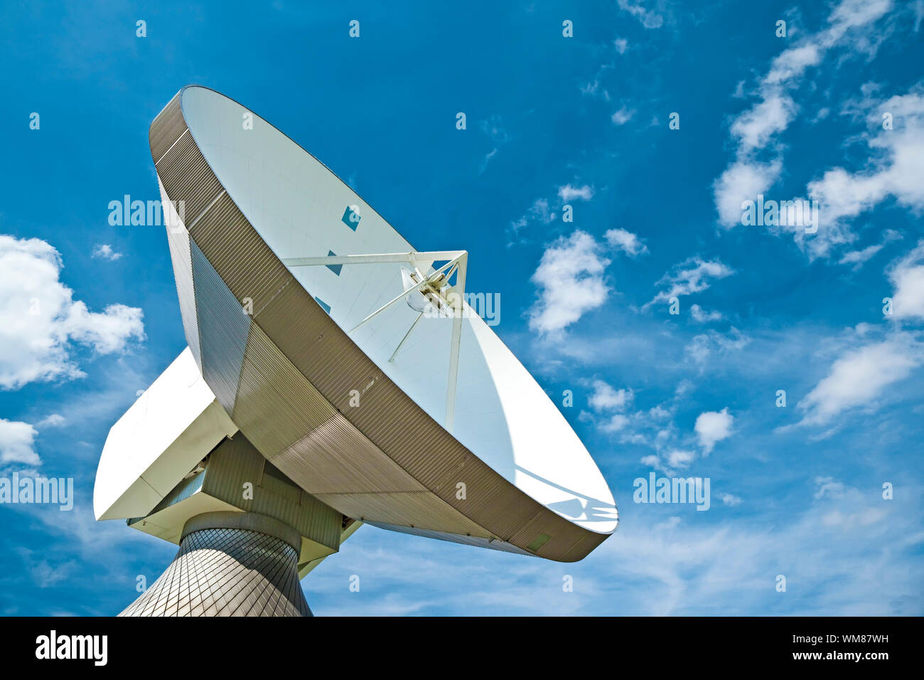 A photography of a sattelite dish and white cloud Stock Photo