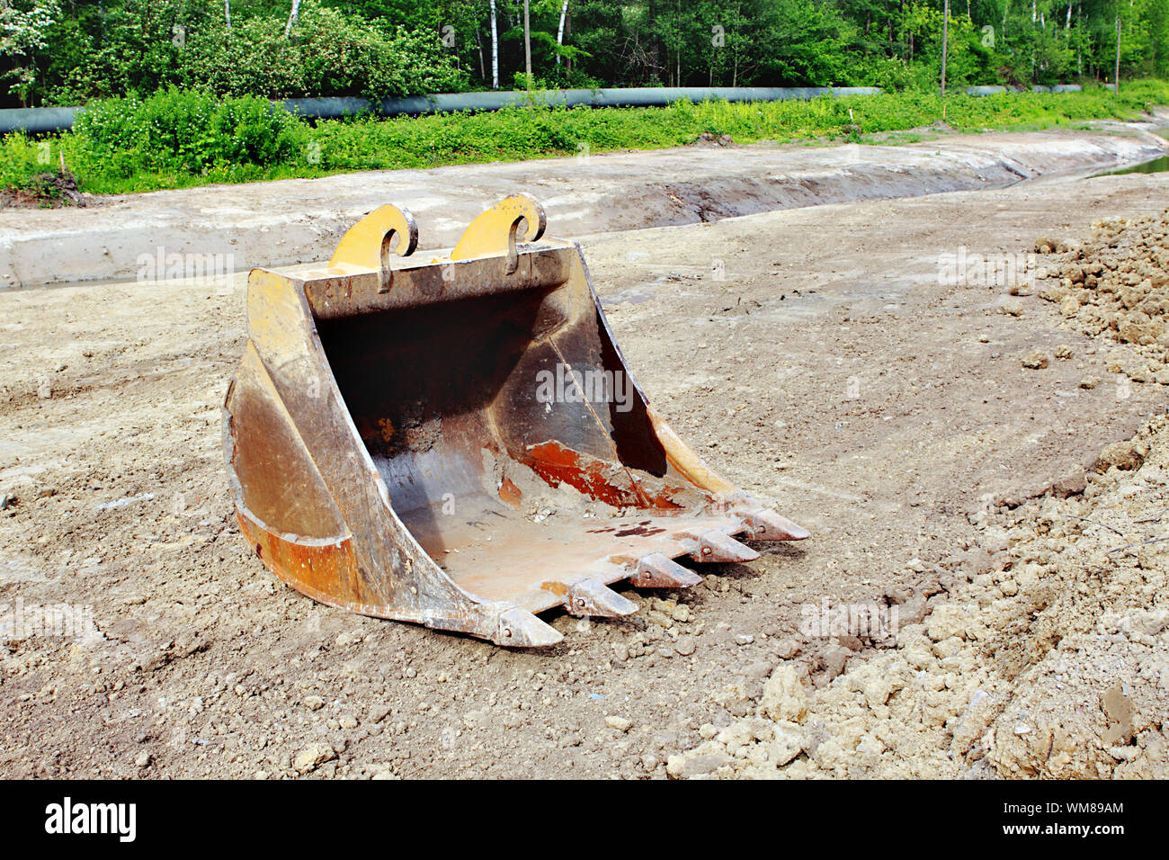bucket form an excavator on the ground outdoor Stock Photo - Alamy