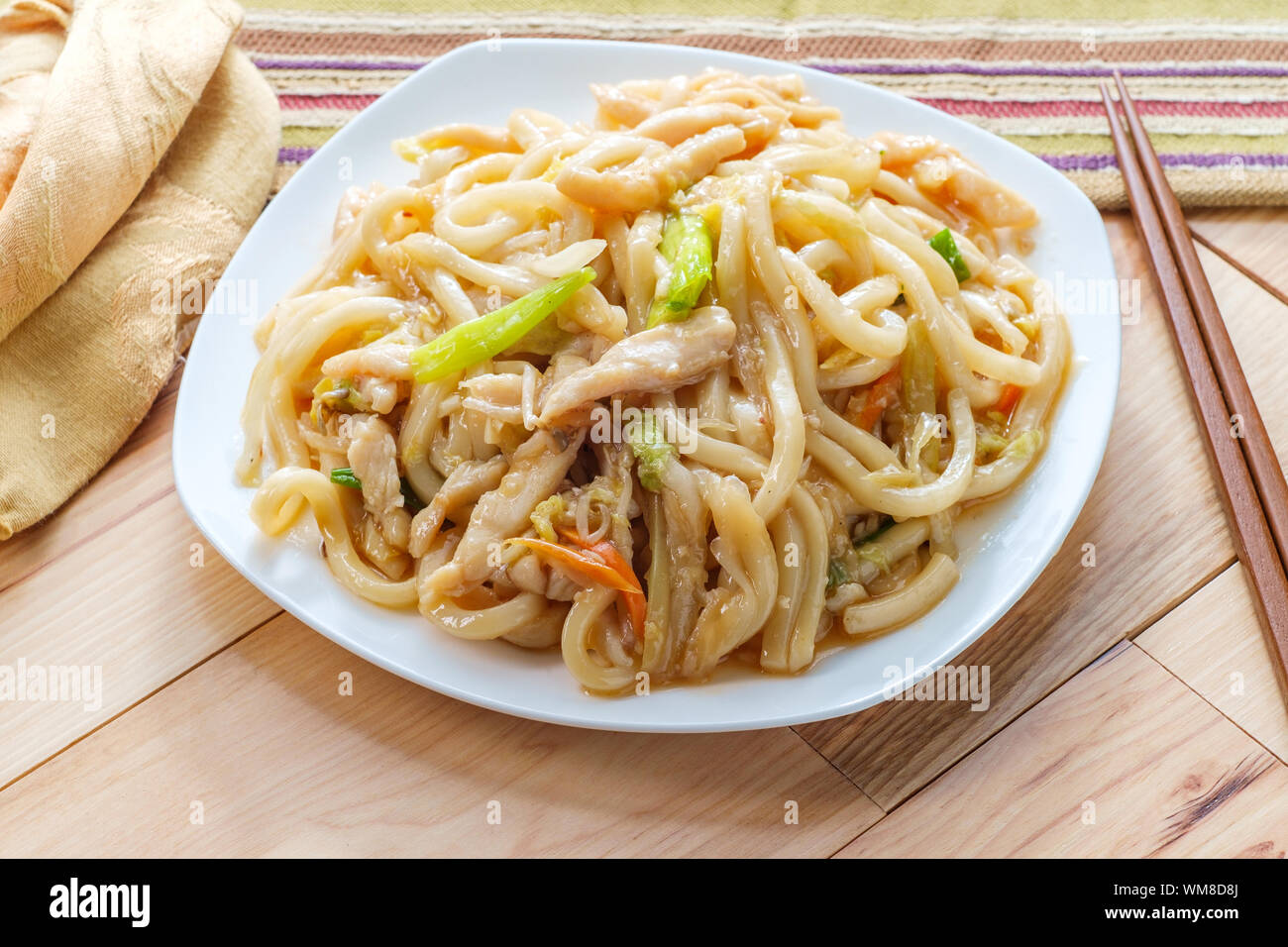 Pan fried Japanese udon noodles in garlic sauce with chicken Stock