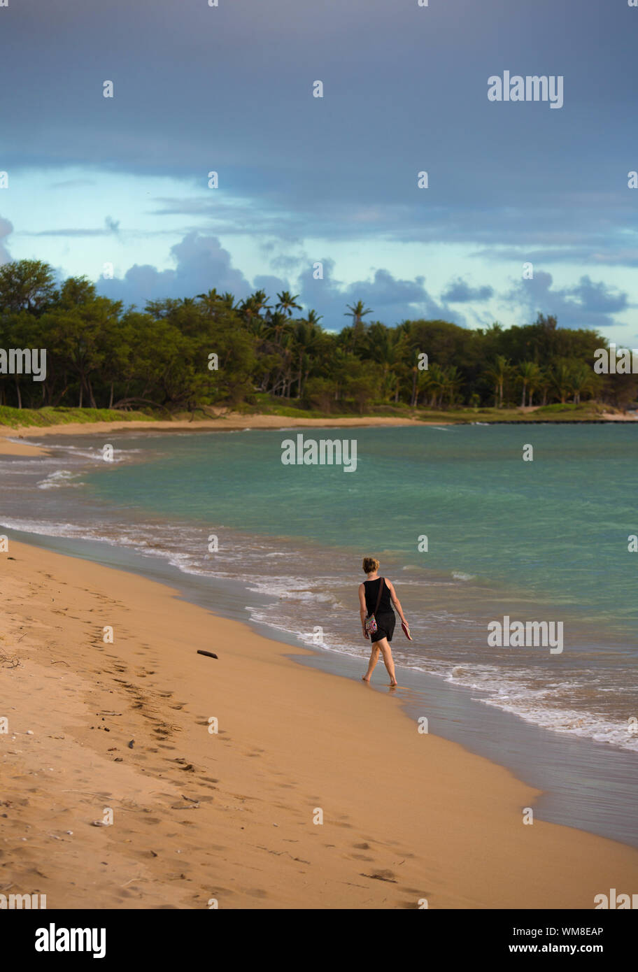 Woman walking on the beach maui hi-res stock photography and images - Alamy