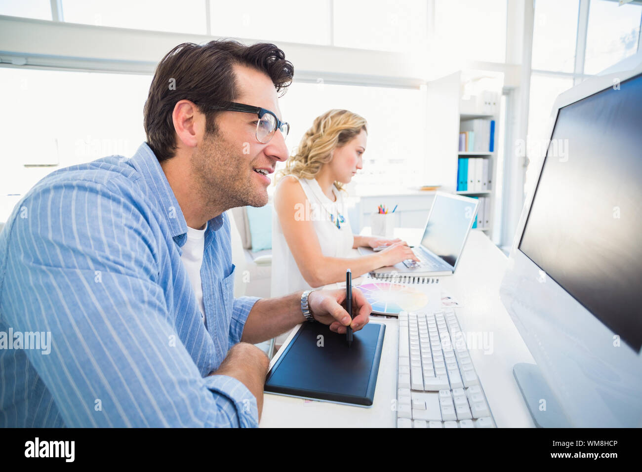 Person Using Graphics Tablet Attractive business woman reading graphics hi-res stock photography and ...