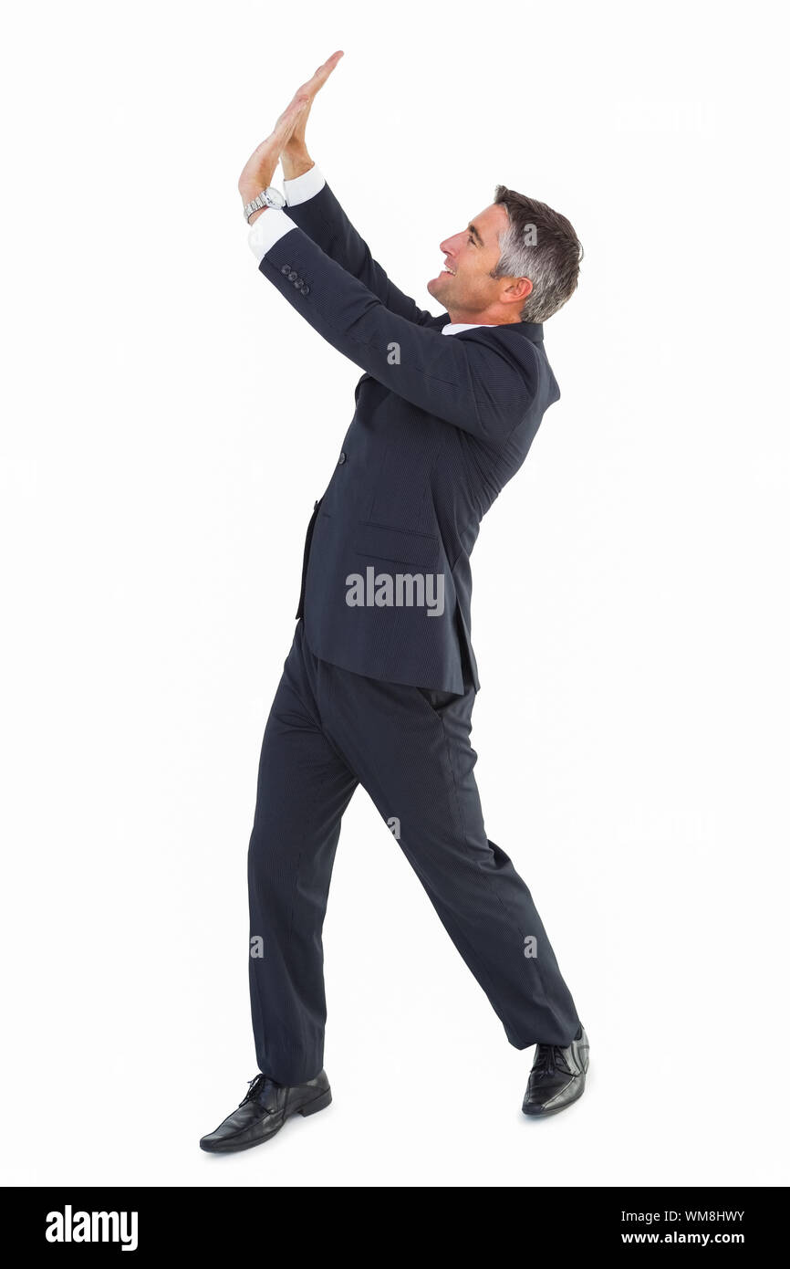 Happy businessman with his arms up on white background Stock Photo - Alamy