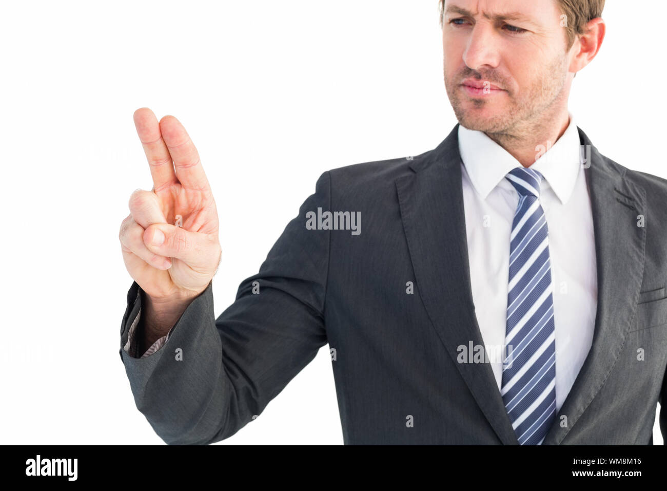 Businessman pointing with his finger on white background Stock Photo ...