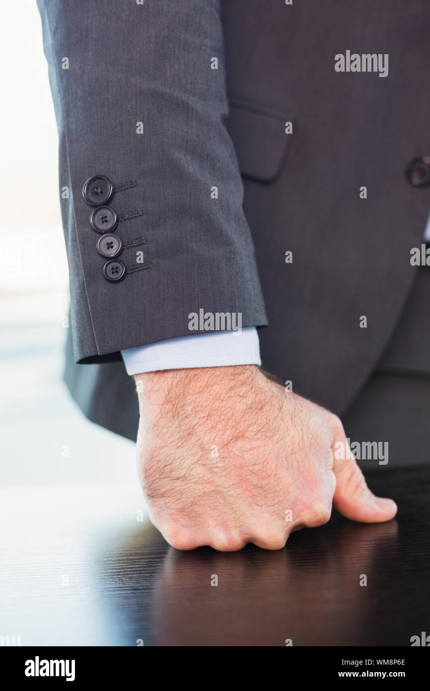 Angry businessman thump the table in his office Stock Photo - Alamy