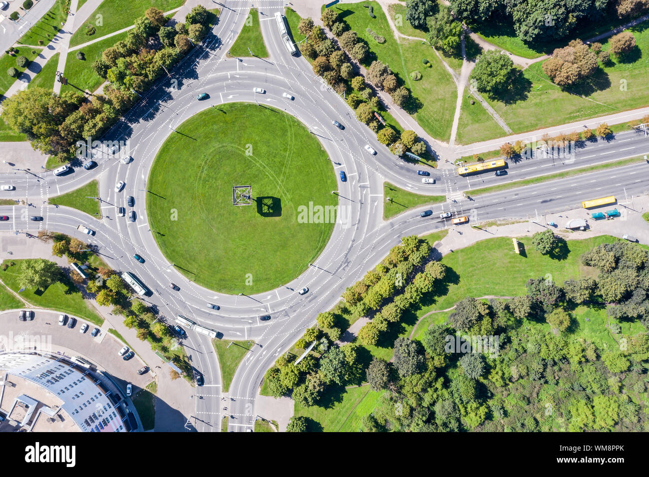 cars in a roundabout junction in urban residential area. birds eye view Stock Photo