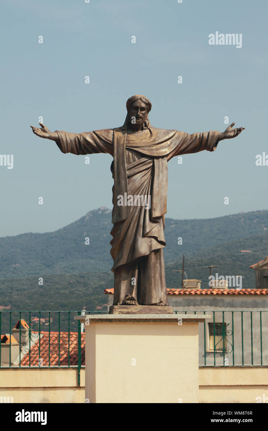 Statue of Christ on pedestal. Propriano, Corsica, France Stock Photo