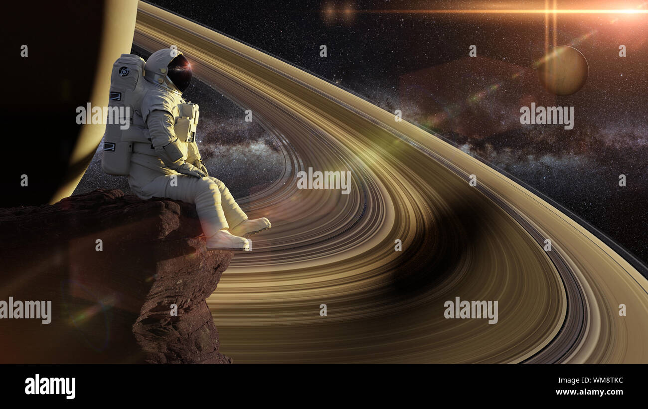 astronaut sitting on a cliff on one of the moons of Saturn Stock Photo -  Alamy