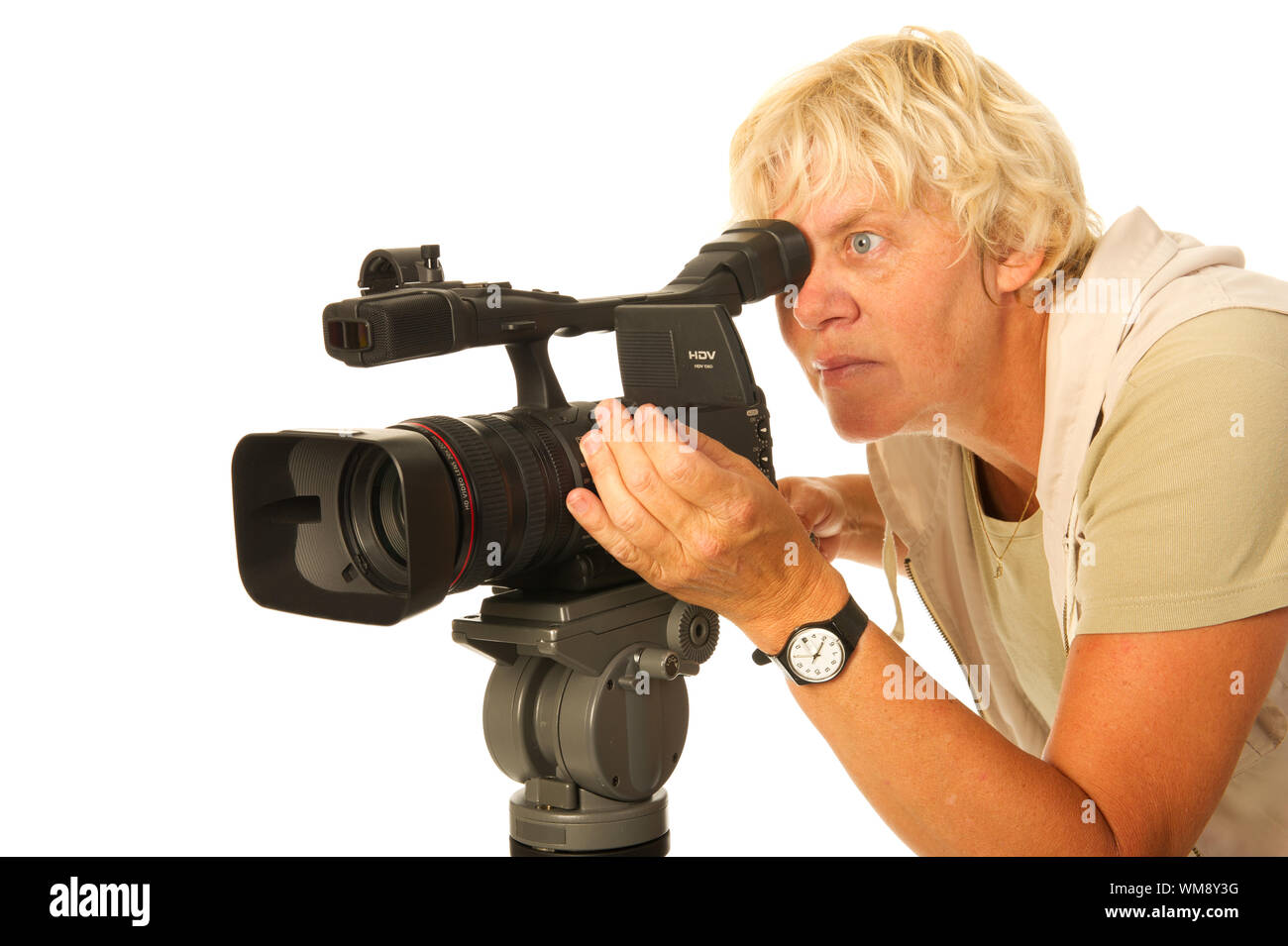 Professional video camera and elderly camera woman on white background