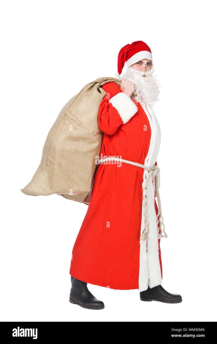 Santa claus with a sack of gifts isolated on white Stock Photo - Alamy