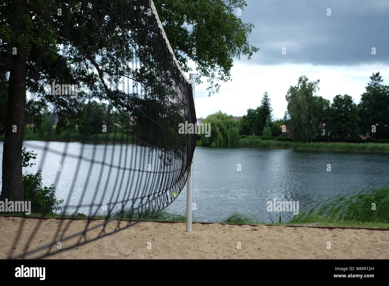 Volleyball Net On Sand By Lake Stock Photo - Alamy