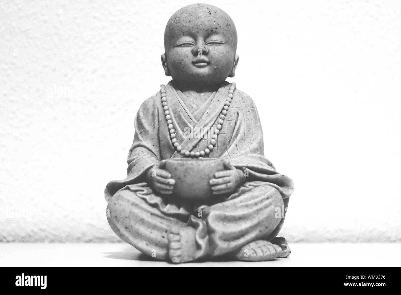 Closeup Of Monk Statue By Wall Stock Photo Alamy