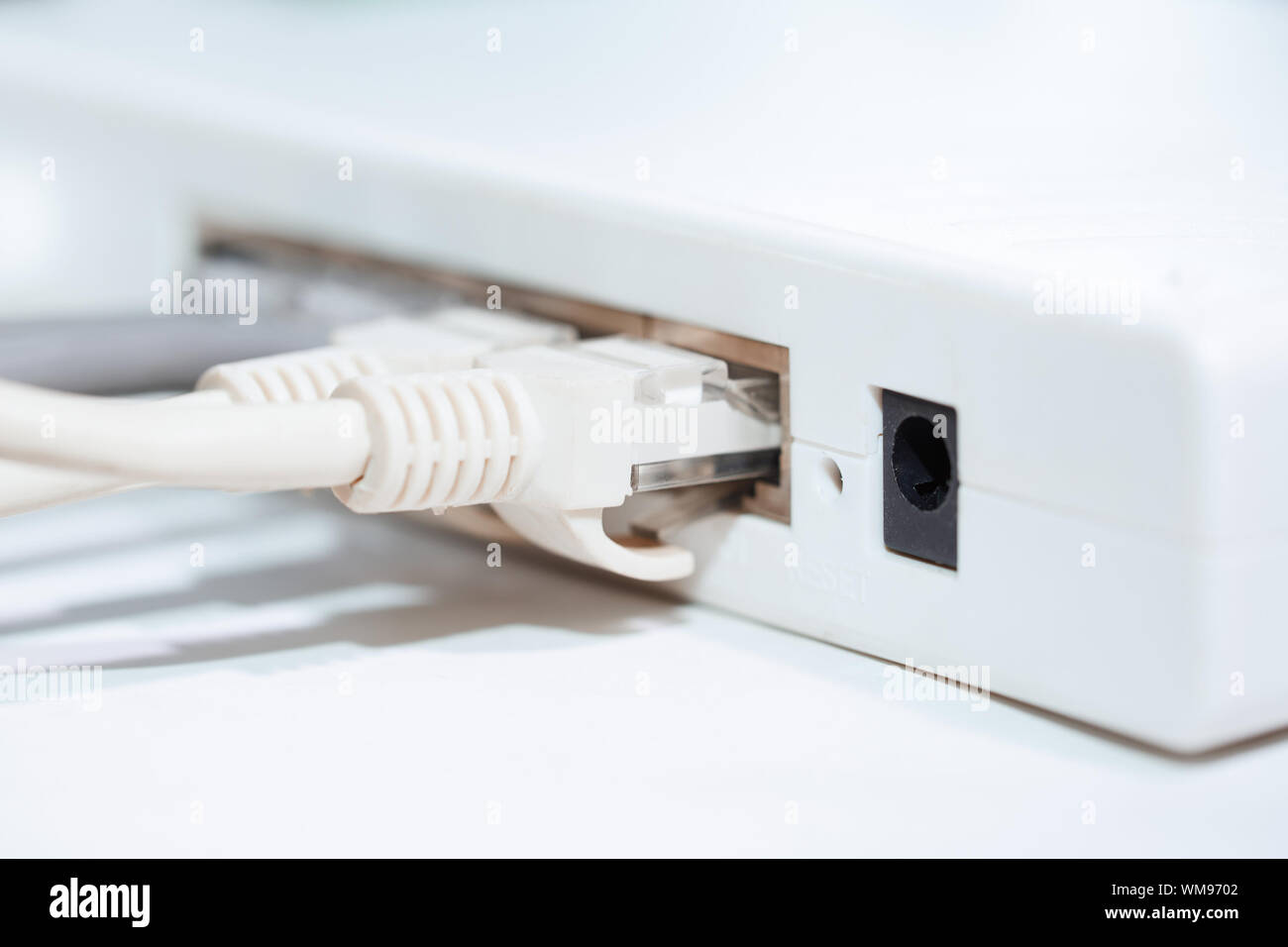 Network modem with cables. Closeup horizontal photo Stock Photo Alamy