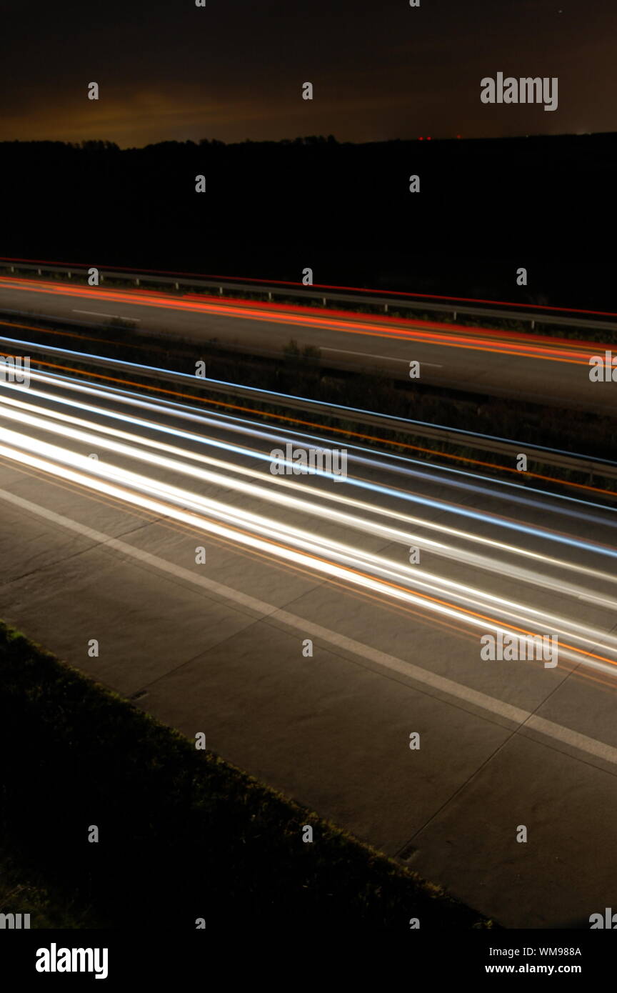 highway at night with car traffic and lights Stock Photo