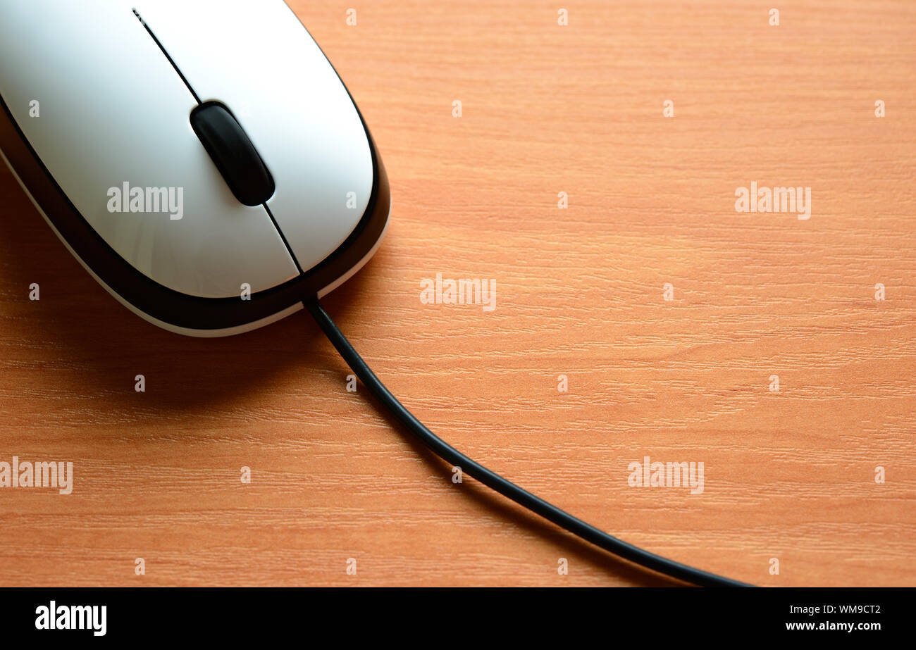 White Wired Computer Mouse on the Wooden Table Stock Photo