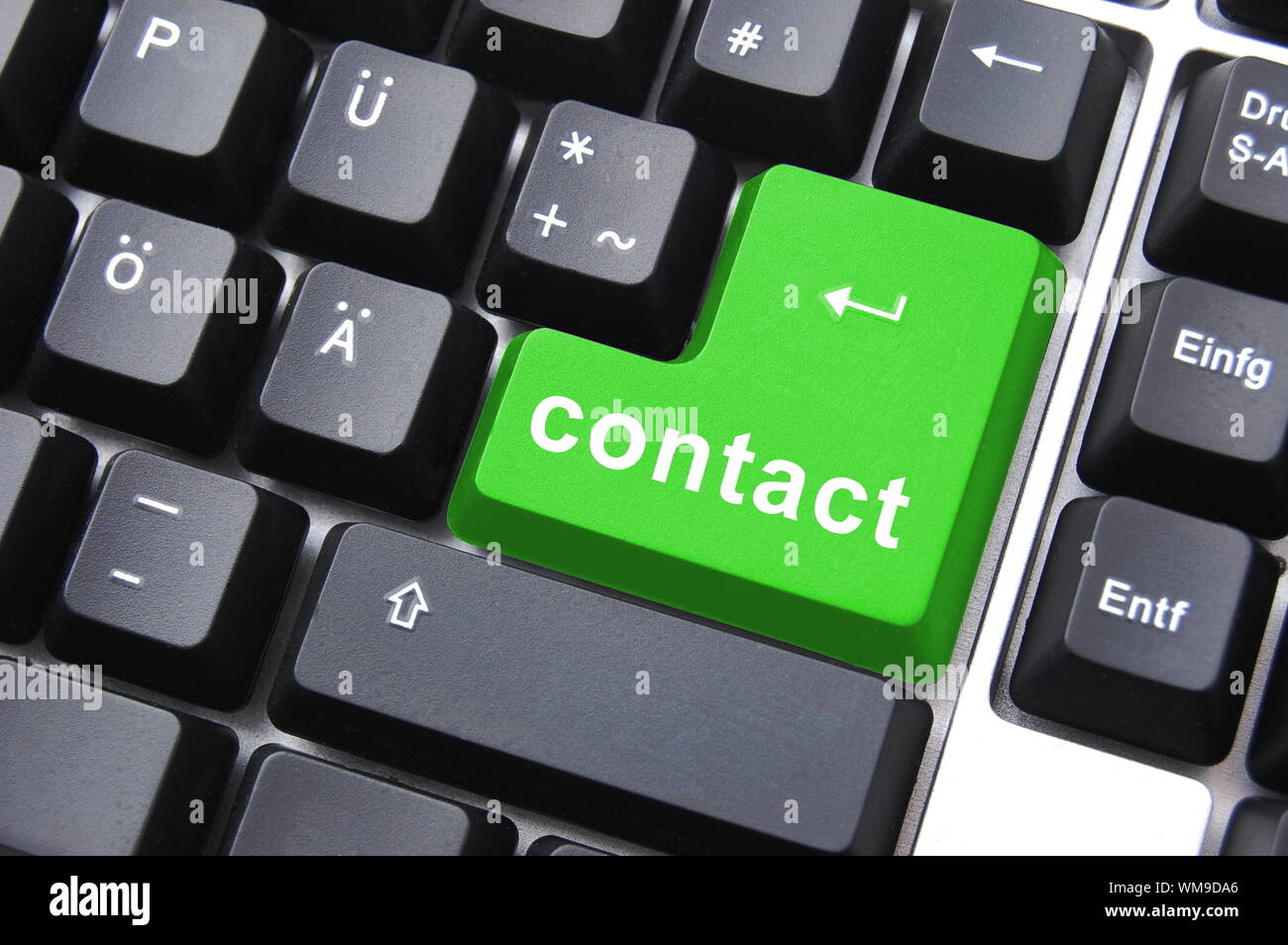 contact text written on a computer keyboard Stock Photo