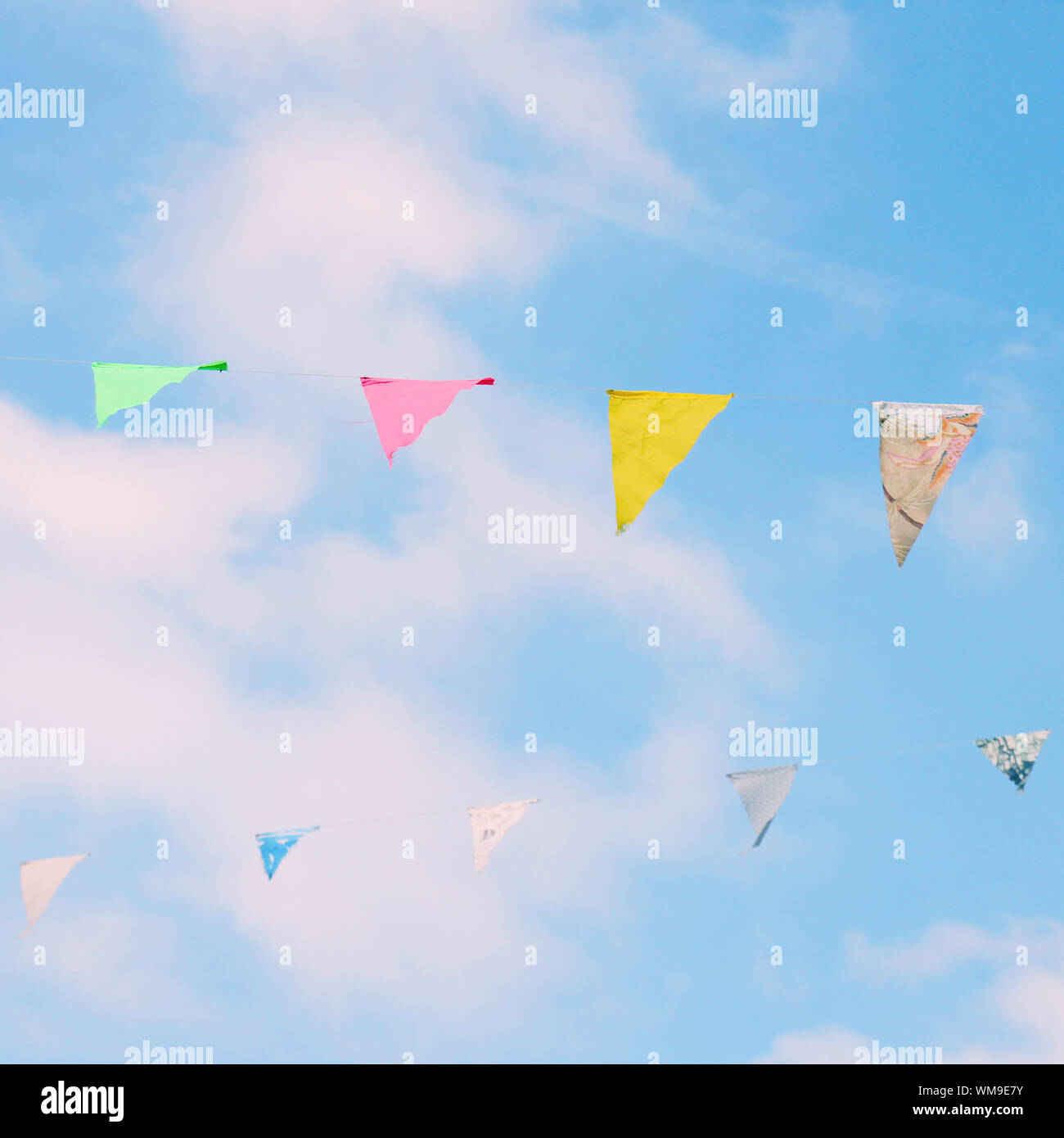 Colorful bunting flags on blue sky with retro filter effect Stock Photo ...