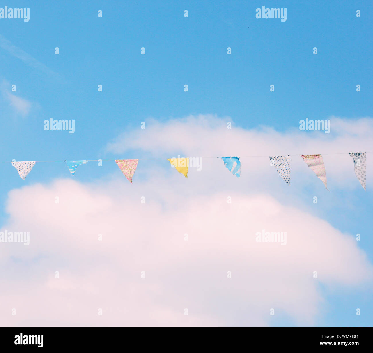 Colorful bunting flags on blue sky with retro filter effect Stock Photo ...