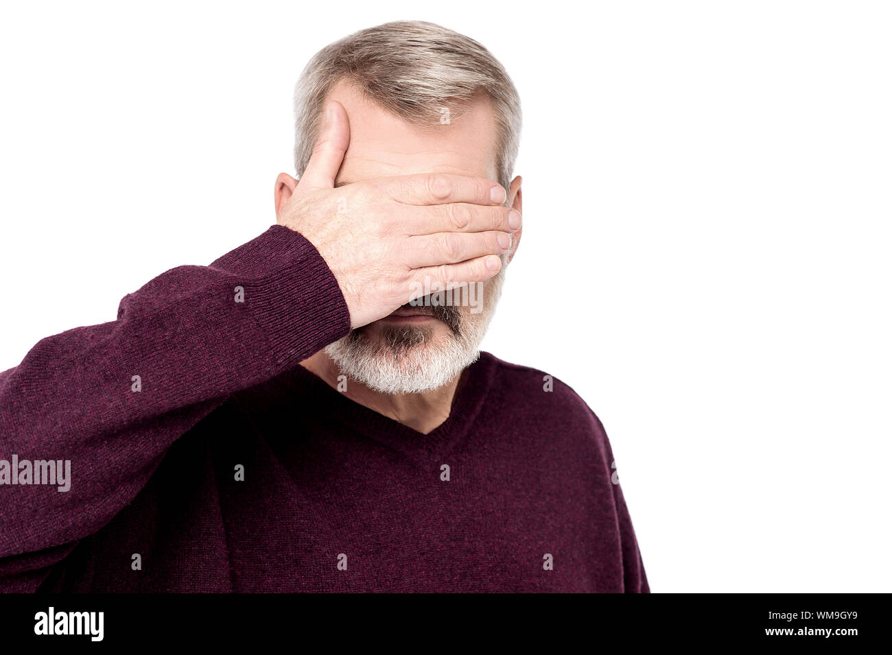 Mature male covering eyes with his hand Stock Photo - Alamy
