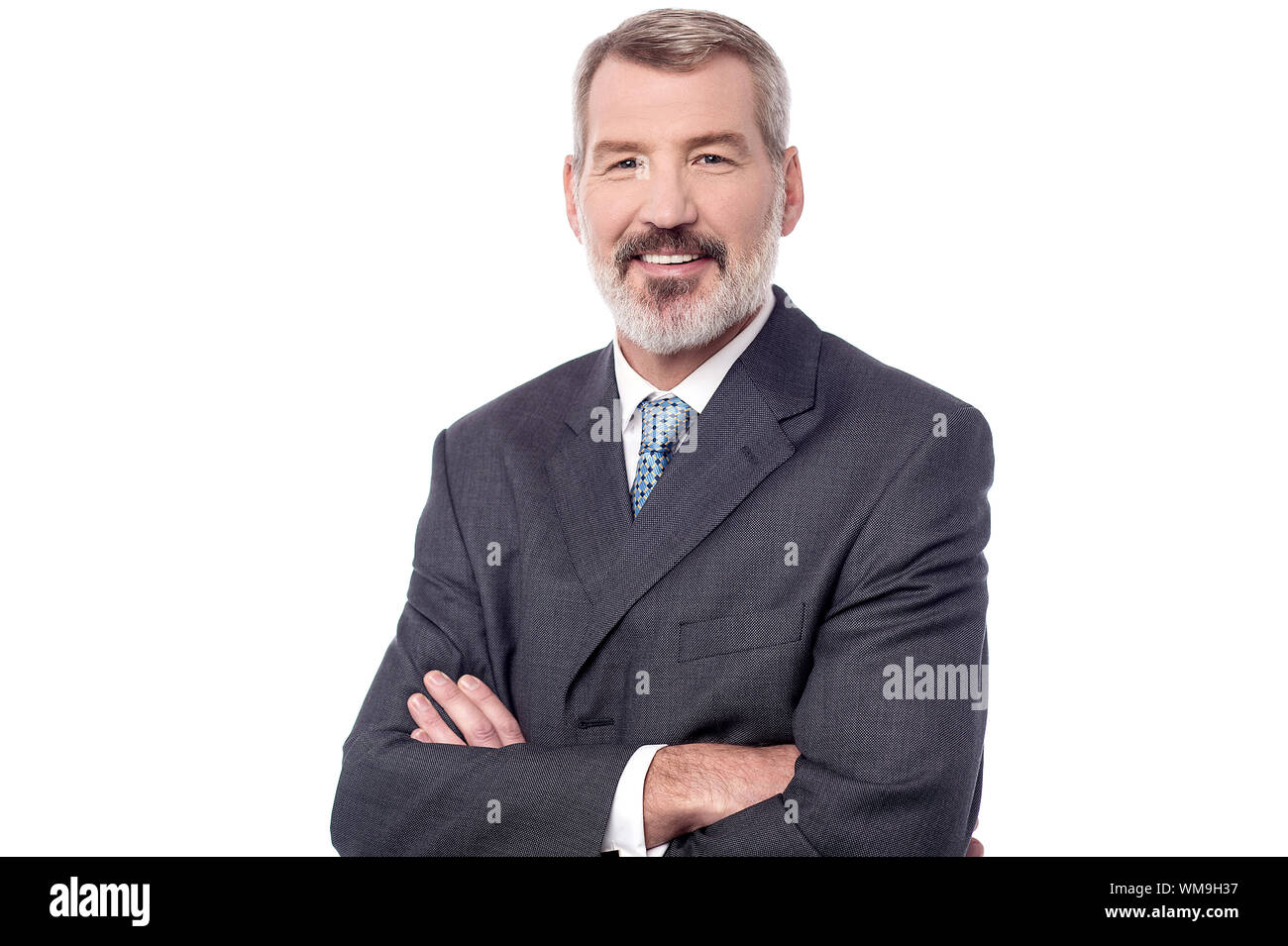 Mature businessman posing with crossed arms Stock Photo - Alamy